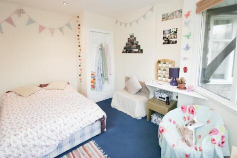 Bright and charming bedroom with a cozy double ...