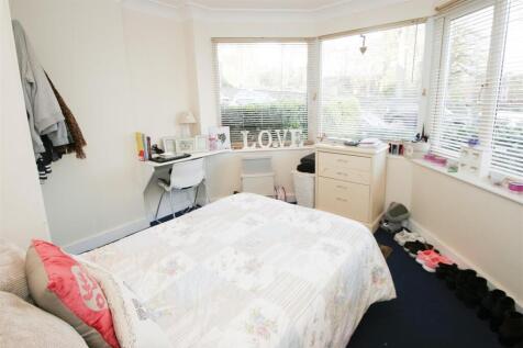 Bright and tidy bedroom with large windows prov...