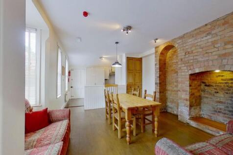 Bright open-plan living and dining area with wo...