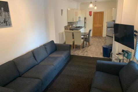 Contemporary open-plan living area leading to a...