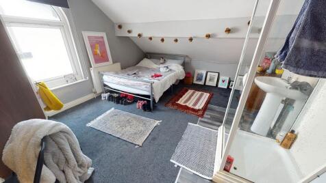 A bright and inviting double bedroom featuring ...