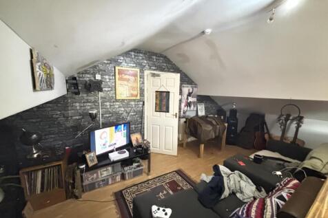 A cozy and inviting living room featuring comfo...