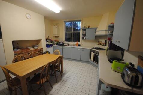 A bright and functional kitchen with ample natu...