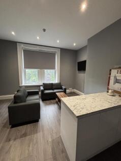 A modern and inviting living room with ample na...