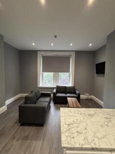A modern, well-maintained living room featuring...