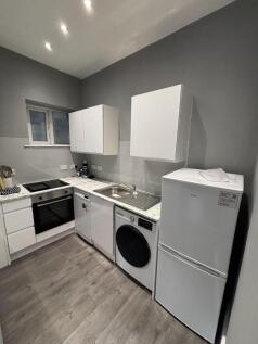 Modern, well-maintained kitchen area featuring ...