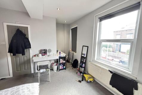 A bright and well-maintained living room with l...