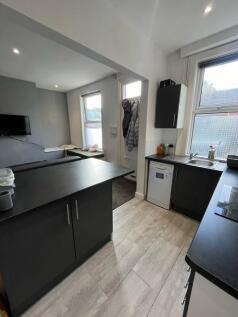 Bright and modern living room with large window...