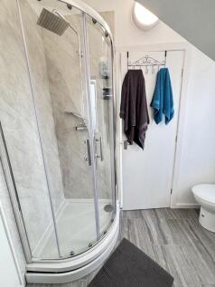 A clean and modern bathroom featuring a spaciou...
