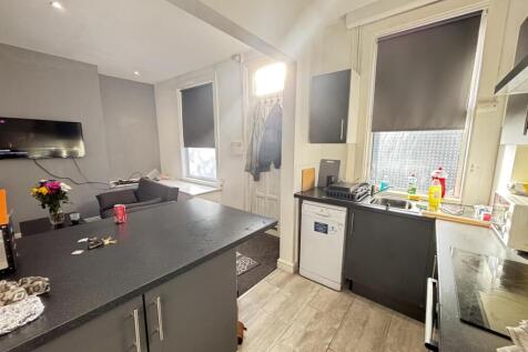 Bright and modern kitchen with ample natural li...