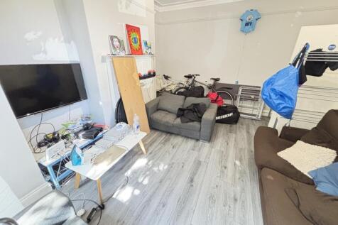 A spacious and modern living room featuring a l...