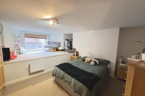 A spacious and well-maintained master bedroom f...