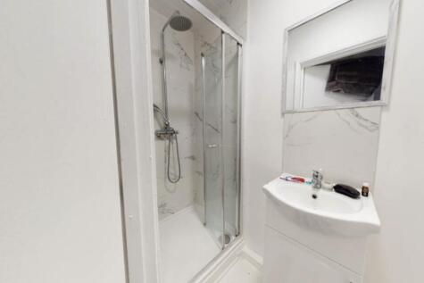A clean and well-maintained bathroom featuring ...
