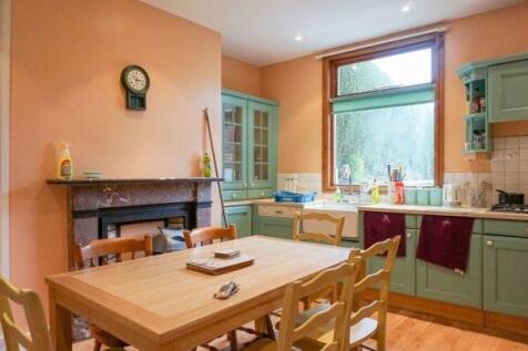 Bright and cheerful kitchen with ample natural ...