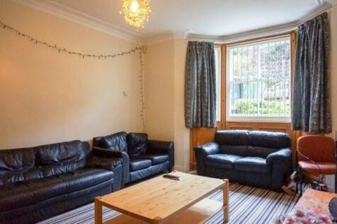 A spacious and welcoming living room with moder...