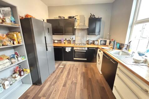 Bright and modern kitchen area featuring ample ...
