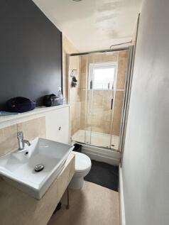 Bright and modern bathroom featuring a spacious...