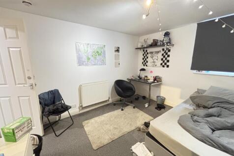 Bright and welcoming living room featuring a co...