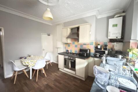 A bright and well-maintained kitchen with moder...