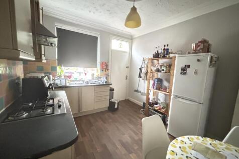 Bright, well-equipped kitchen with modern appli...