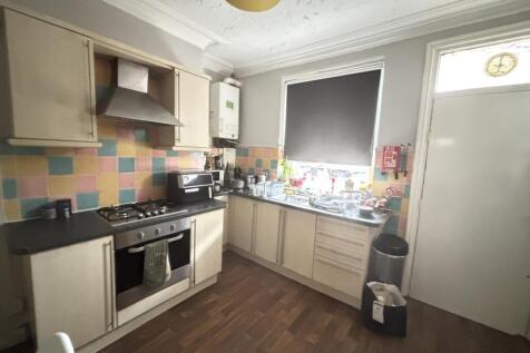 Bright and welcoming kitchen with ample counter...