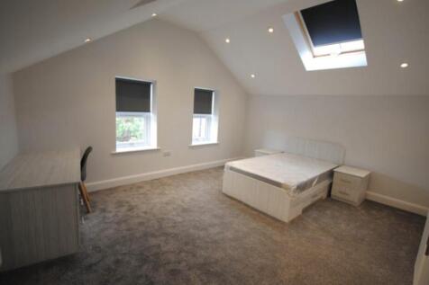 Bright and spacious master bedroom featuring a ...