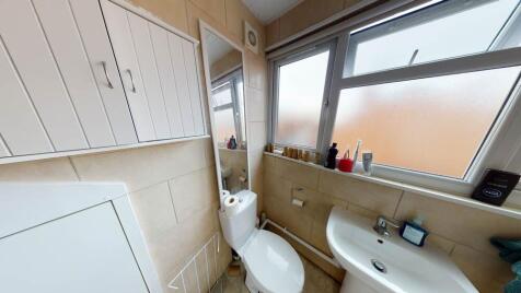 Bright and well-maintained bathroom with a larg...