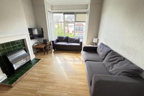 Bright and welcoming living room featuring a la...