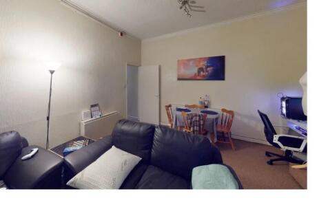 A contemporary living room with a comfortable b...