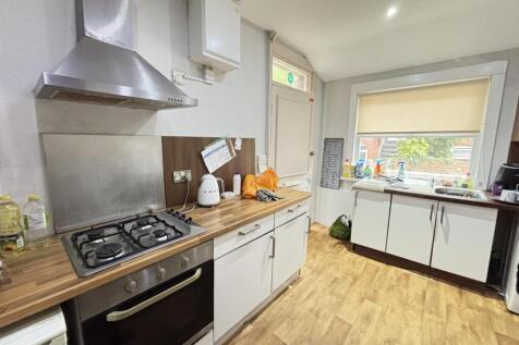 Bright and clean kitchen featuring modern appli...