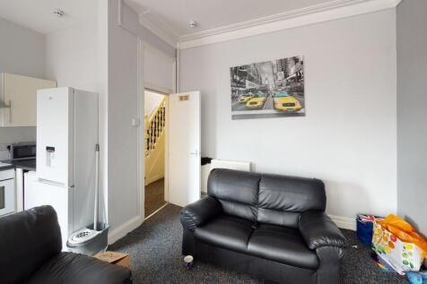 Bright and modern living room featuring comfort...