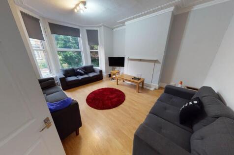 Bright and inviting living room with large wind...