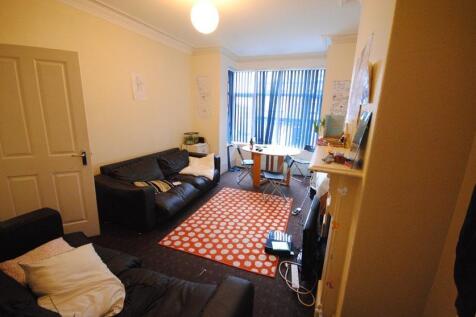 Bright, comfortable living room with two sofas,...