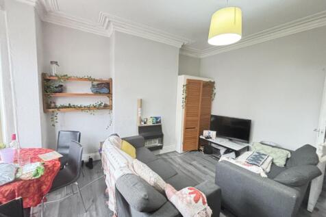 Bright and welcoming living room featuring comf...