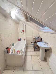 A clean and well-maintained bathroom with a lar...