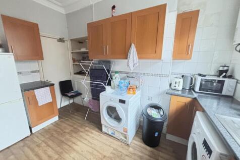 Bright and well-organized kitchen with ample co...