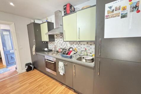 A bright and well-maintained kitchen with moder...