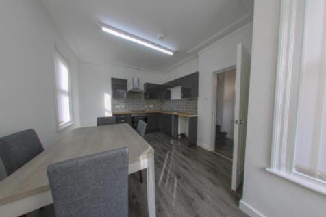 Modern kitchen area with a bright and airy atmo...