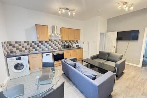 A modern, well-lit living area featuring contem...