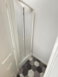 A clean, well-maintained bathroom with tiled fl...