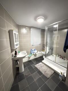 A clean and well-maintained bathroom featuring ...