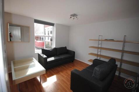 A bright and modern living room featuring a com...