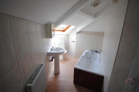 Bright and well-maintained bathroom featuring a...