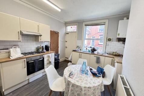 Bright and welcoming living room with large win...