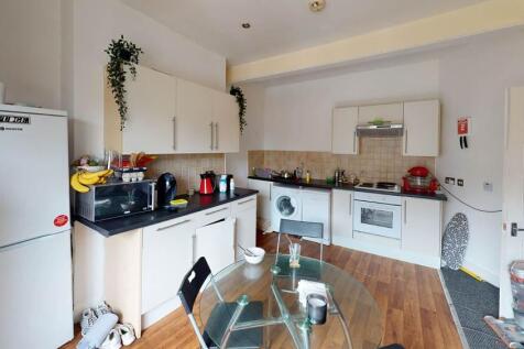 A bright and modern kitchen with ample counter ...