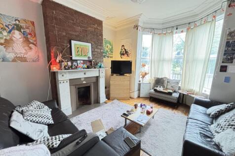 A bright and inviting living room with large wi...