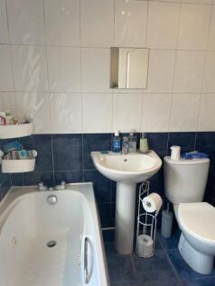 A clean, well-maintained bathroom featuring a b...