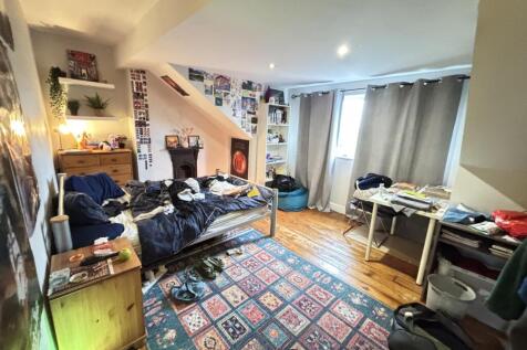 A cozy and lived-in living room featuring a com...