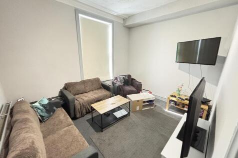 A contemporary living room featuring comfortabl...