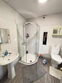 A clean and well-maintained bathroom featuring ...